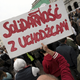 “Solidarity with Refugees” written in the iconic “Solidarity” font.